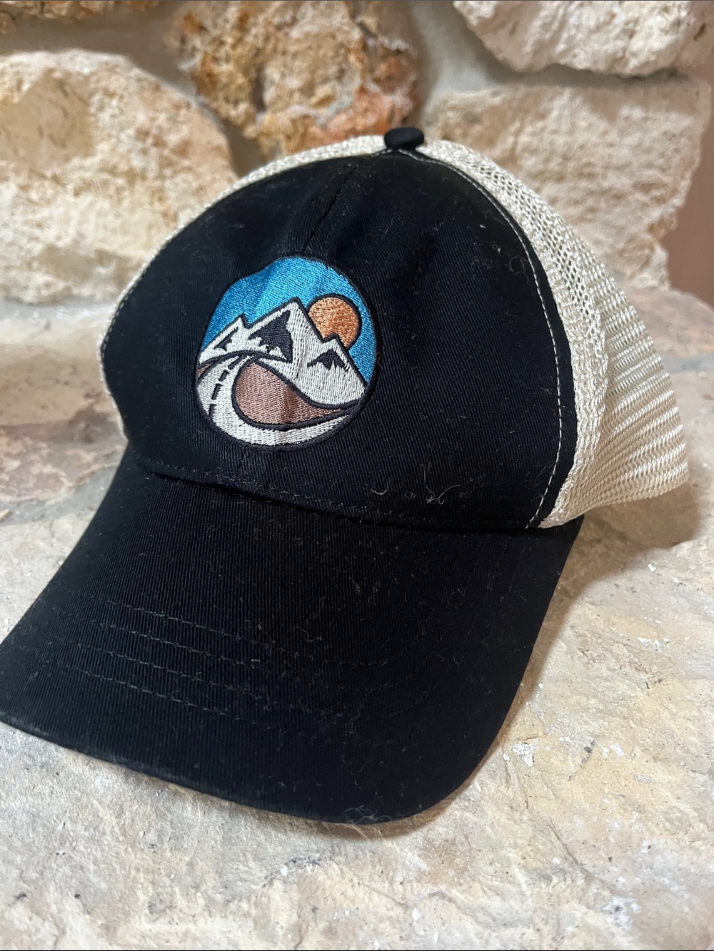 Men's Black and Cream Mesh Trucker Hat with Mountain Patch